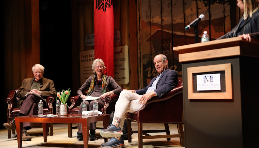 Adam Hochschild and Arlie Russell Hochschild on stage with moderator Paul Solman during the Ford Hall Forum Facing Coups in America