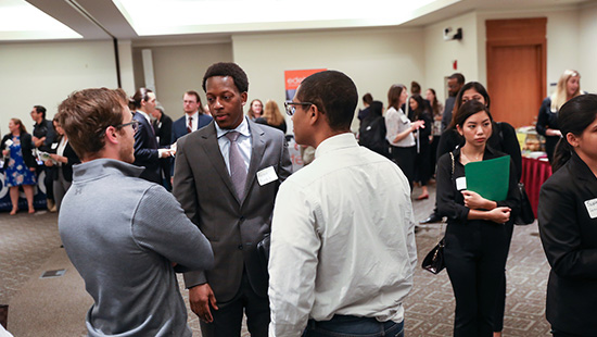 Students chatting with accounting firms at Meet the Firms Night.