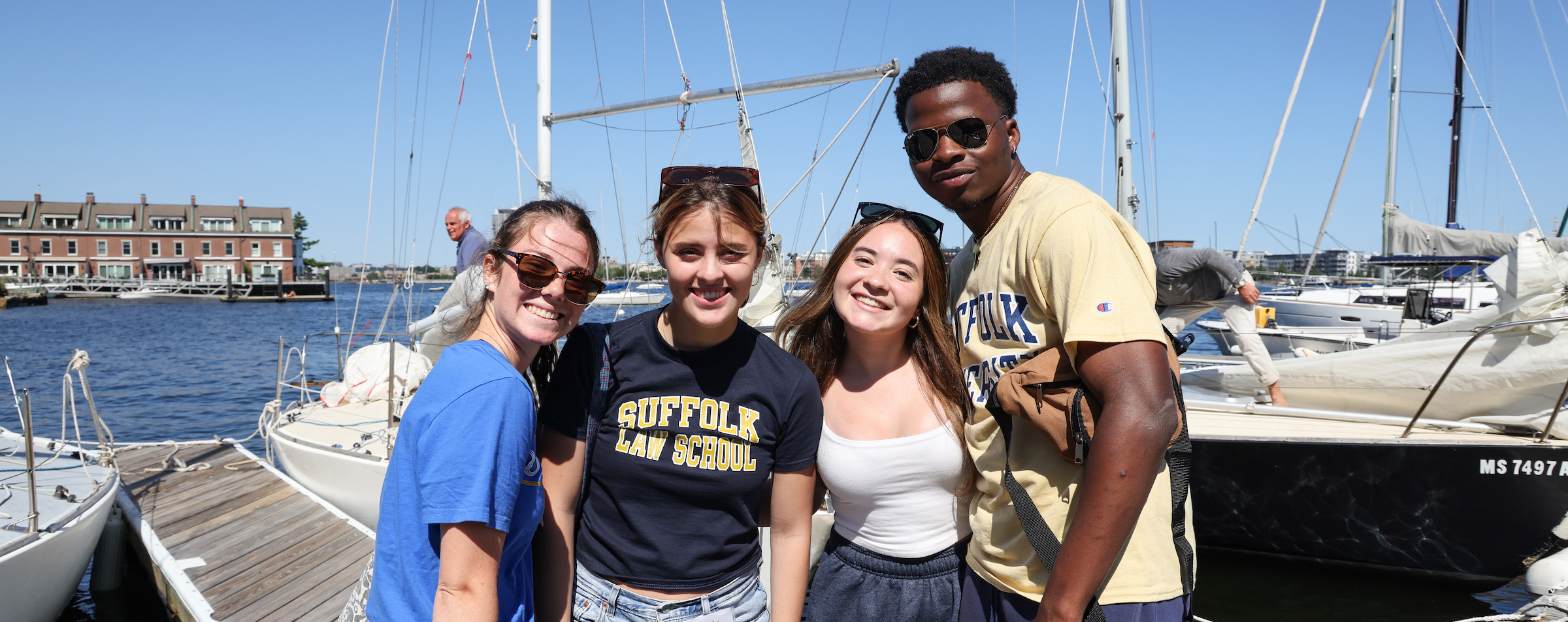 Four Suffolk students pose for a photo together.
