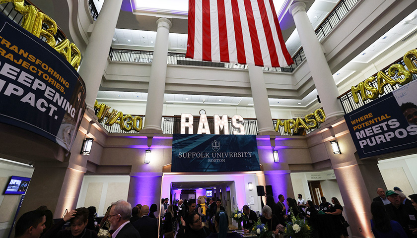 Image of the great hall in Sargent during the 4-program anniversary soiree, with the lighted "RAMS" sign in the middle