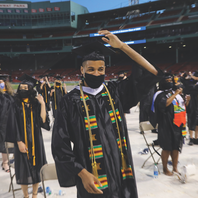 A student prepares to move their tassel during the commencement ceremony