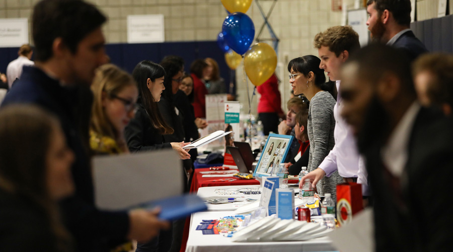A Suffolk student talks with an employer at a Careers fair.