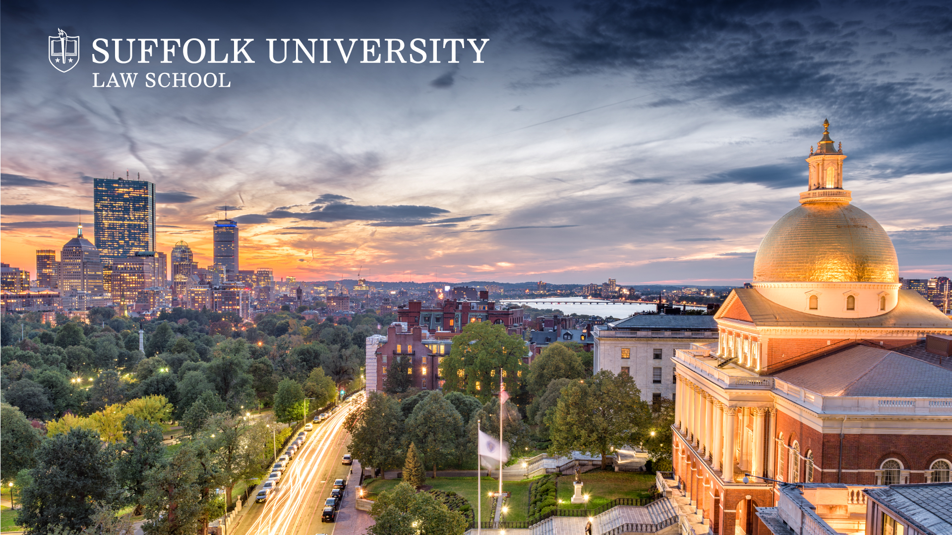 Sunset over Boston's Back Bay and the Massachusetts State House with the Suffolk Law logo in the top corner