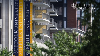 Suffolk University banners on the Smith Residence Hall on Tremont Street with the Suffolk University logo in the top corner