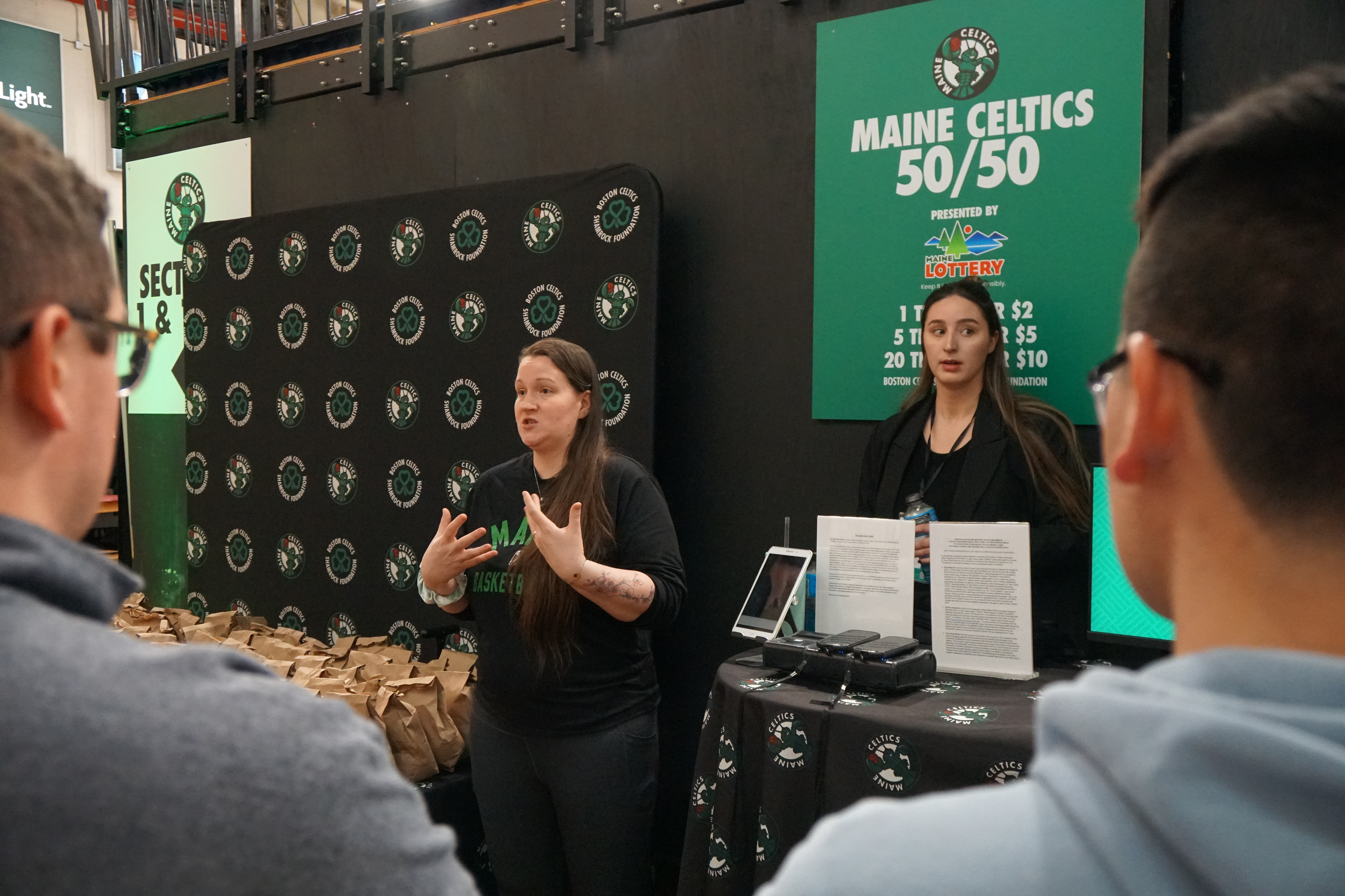 Suffolk students giving a presentation during an internship experience with the Celtics