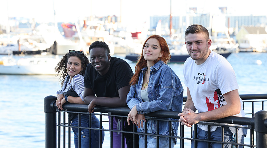 Suffolk students pose for a photo in Piers Park in East Boston.