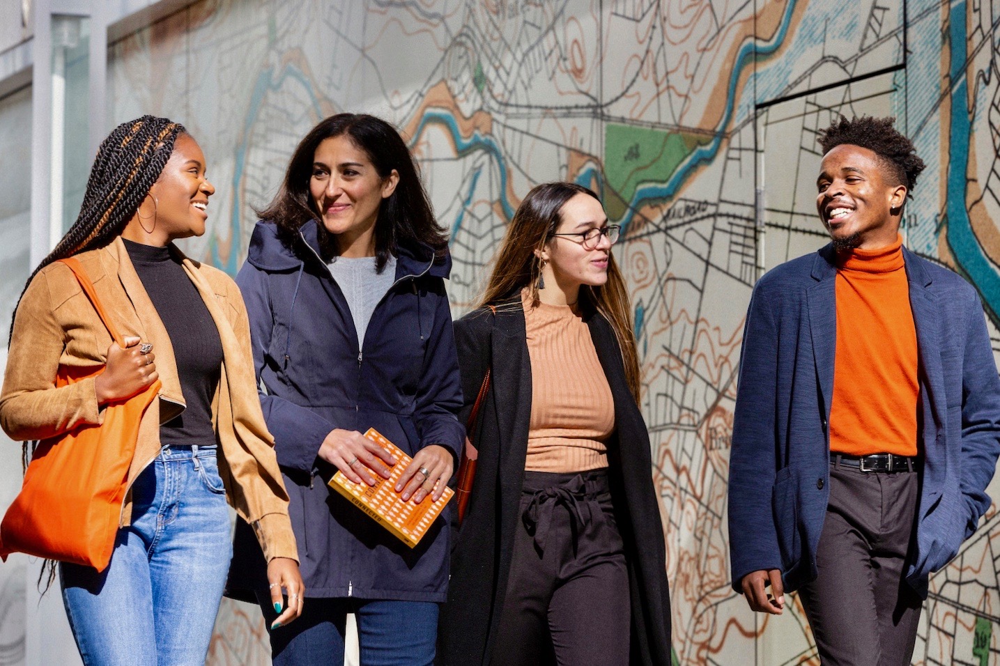 Suffolk students walk with a professor in Boston