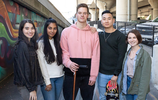 A group of Suffolk students pose for a photo at Underground At Inkblock.