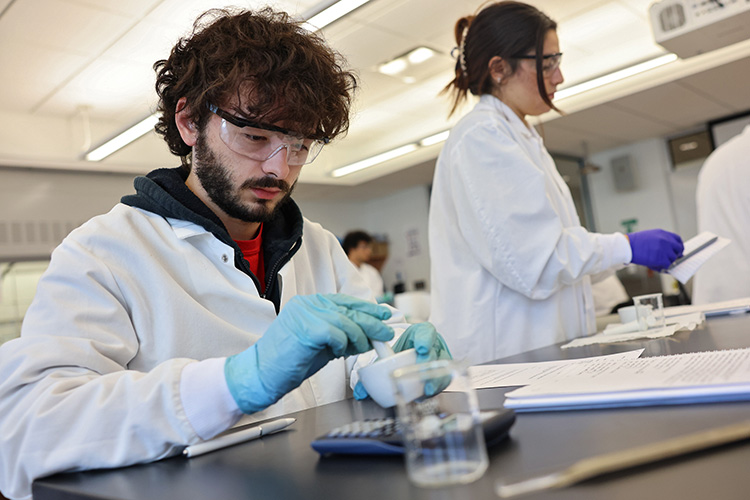 Suffolk University students observe the solar eclipse with eclipse glasses.