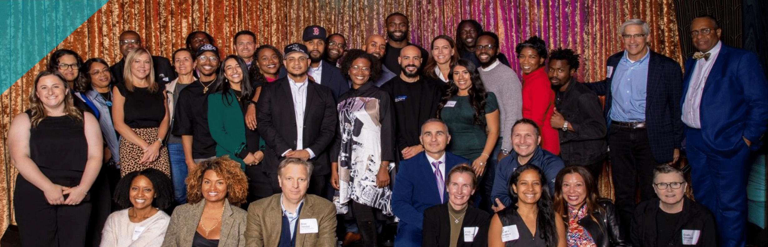 Boston Xchange and Suffolk University team members gather together.