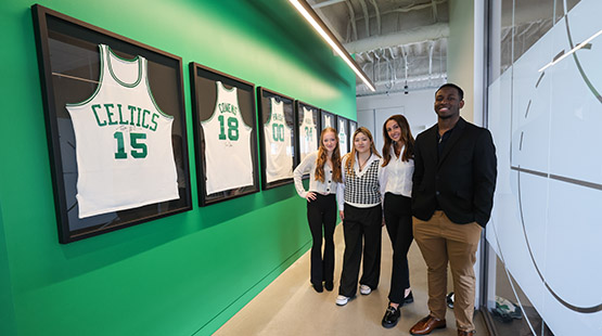 Students standing in front of jerseys