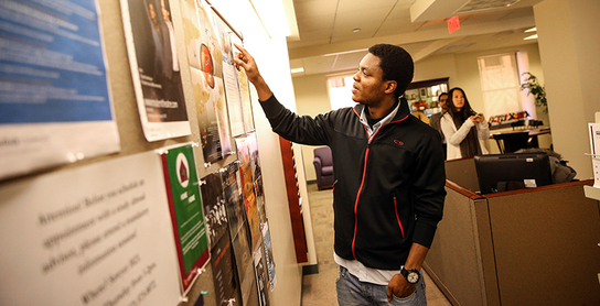 A student looking at a wall