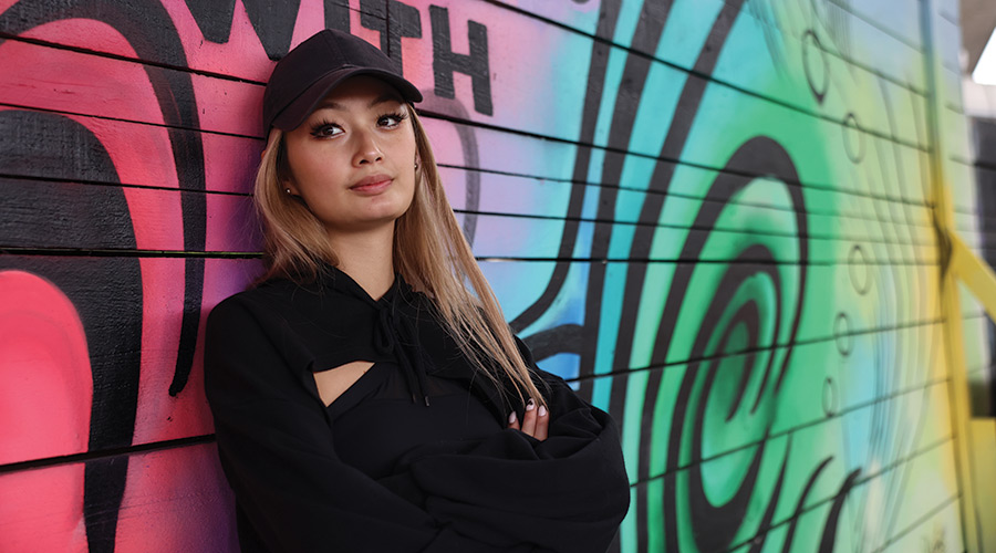 Suffolk student Shirley poses for a photo at Ink Block.
