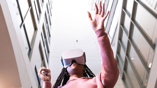 Suffolk student using a virtual reality headset.