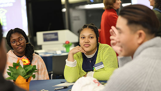 Students at a table during the kick-off session for First Gen Students