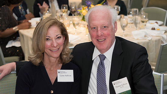 Thomas “Tom” M. Sullivan, JD ’94 (right) and Lynne Sullivan at a dinner event hosted in honor of commencement.