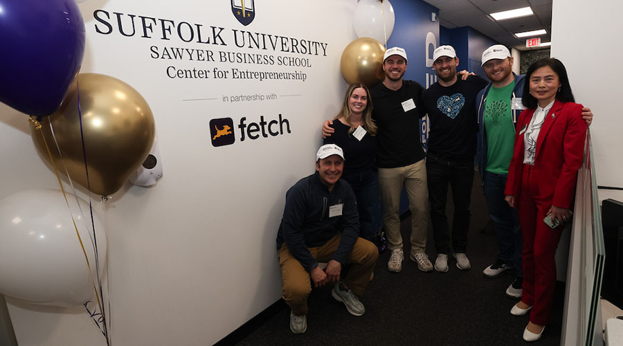 Dean Amy Zeng standing with event attendees