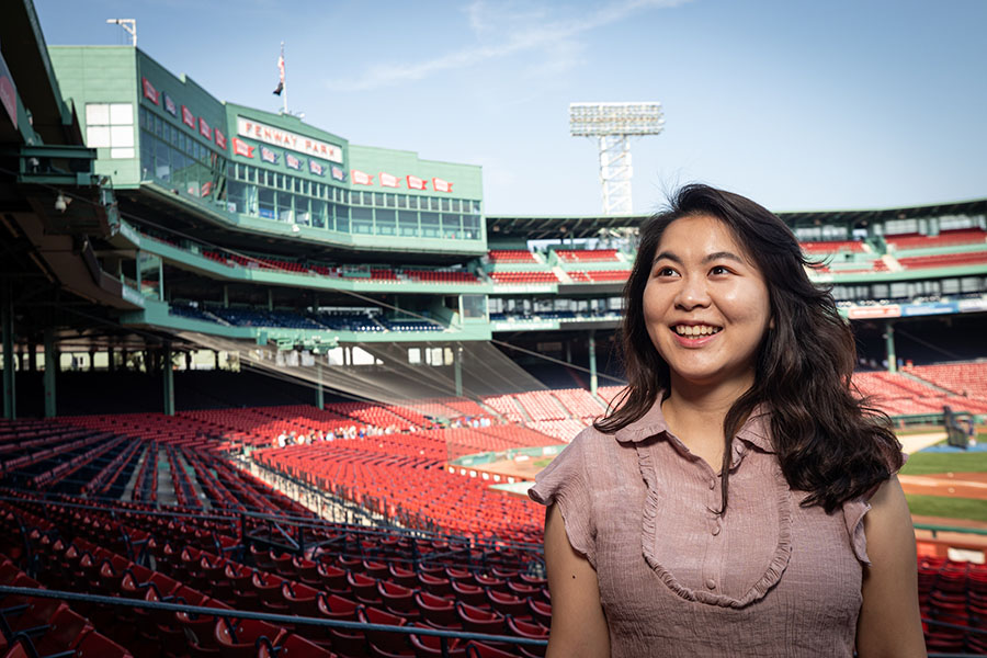 A student smiles in Fenway Park