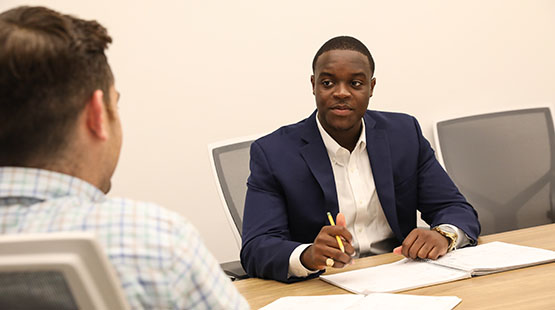 Student and career counselor sitting at a table