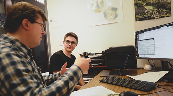 Student and career counselor looking at a computer screen