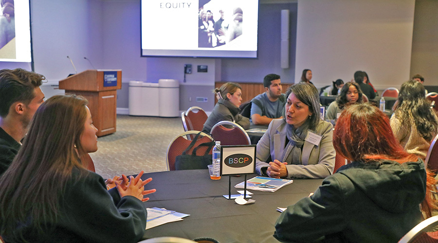A table of attendees at an Equity in Action event