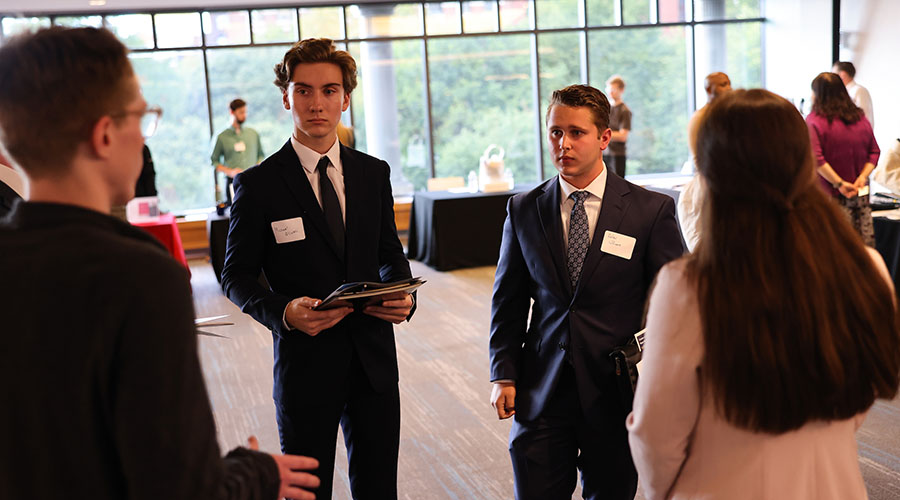 Students talk with potential employers at a Meet the Firms event
