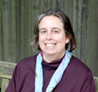 Professor Susan Sered portrait with gray background