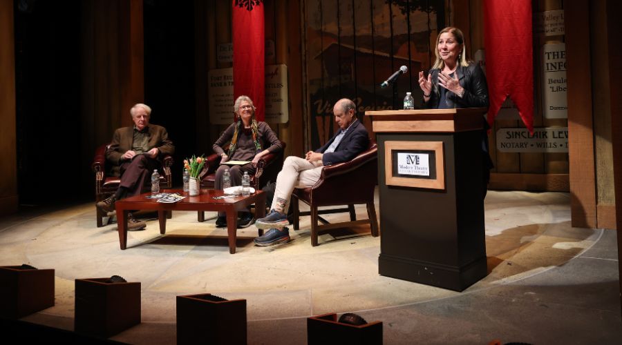 Discussion at podium in Ford Hall Forum