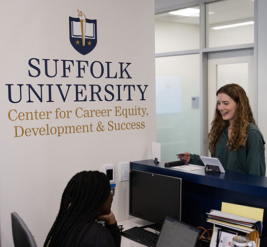 Student speaks with job counselor in the Career Center