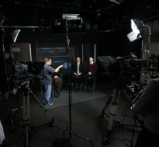 Director instructs on-air students in Studio 73