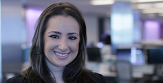 Tara Lachapelle, student smiling in front of computer lab