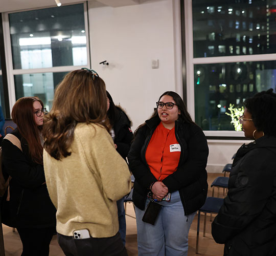Two students talking at a career fair