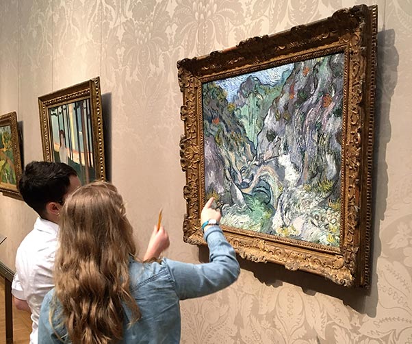 Students observe a Van Gogh painting at the Museum of Fine Arts in Boston, MA.