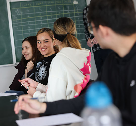 Students in a math class smiling