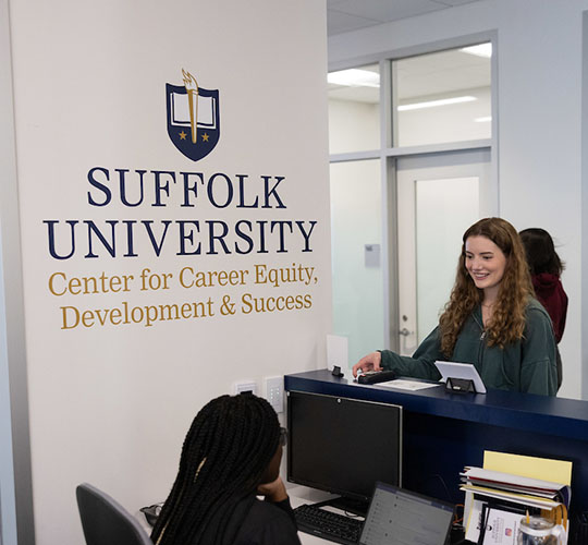 Student at the reception desk in the Career Center