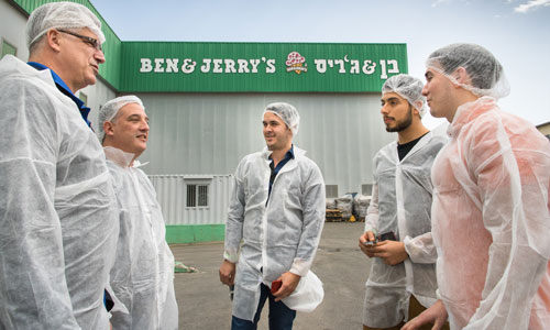 A group of Suffolk students are escorted through the Ben & Jerry's facility in Israel.