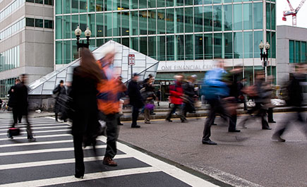 People crossing the street in front of South Station, Boston