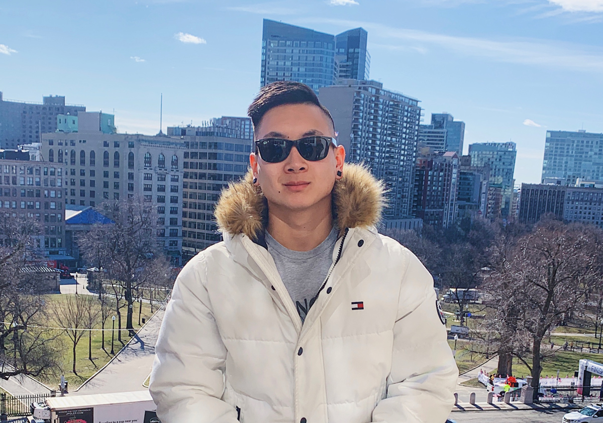 Dan Redznak smiling at camera overlooking Boston.