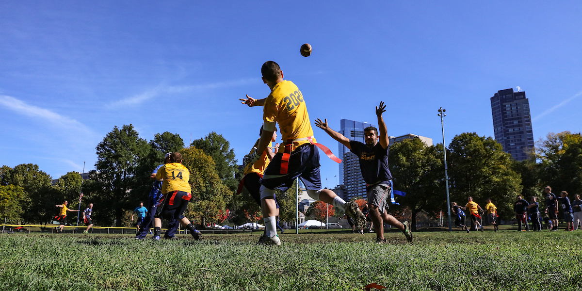 Dan Redznak throws a pass during a football game on the Boston Common.