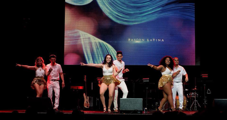 Suffolk student Gabriela Soto Cotto on stage with her dance team Pasion Latina.