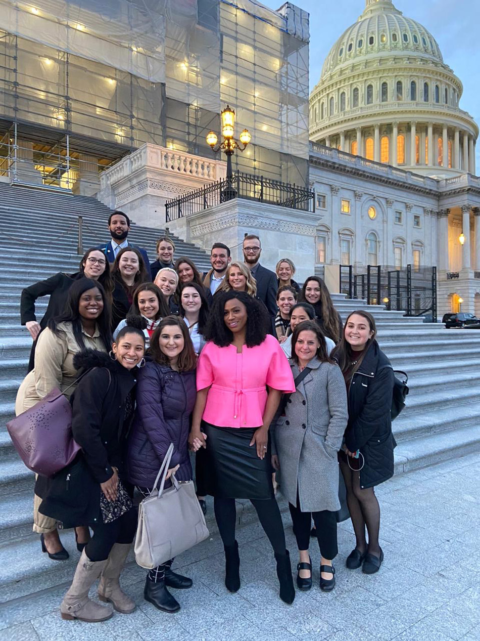 Suffolk student Gabriela Soto Cotto poses with classmates in Washington D.C. with US Rep. Ayanna Pressley.