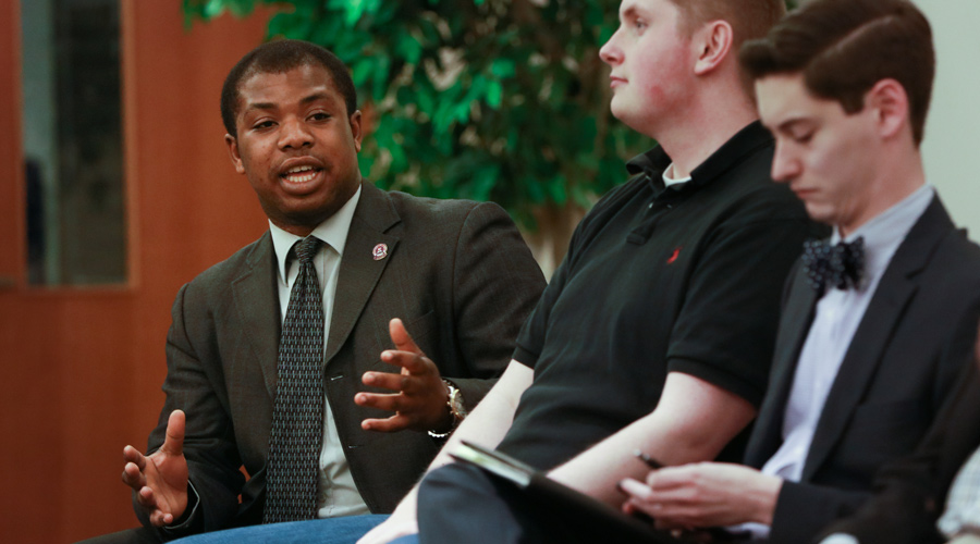 Suffolk student Isaac Boateng speaking during a political debate while a student.