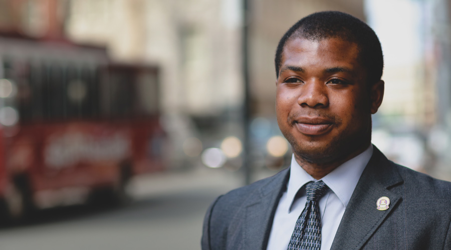 Suffolk student Isaac Boateng poses for a portrait on Tremont Street in Boston.