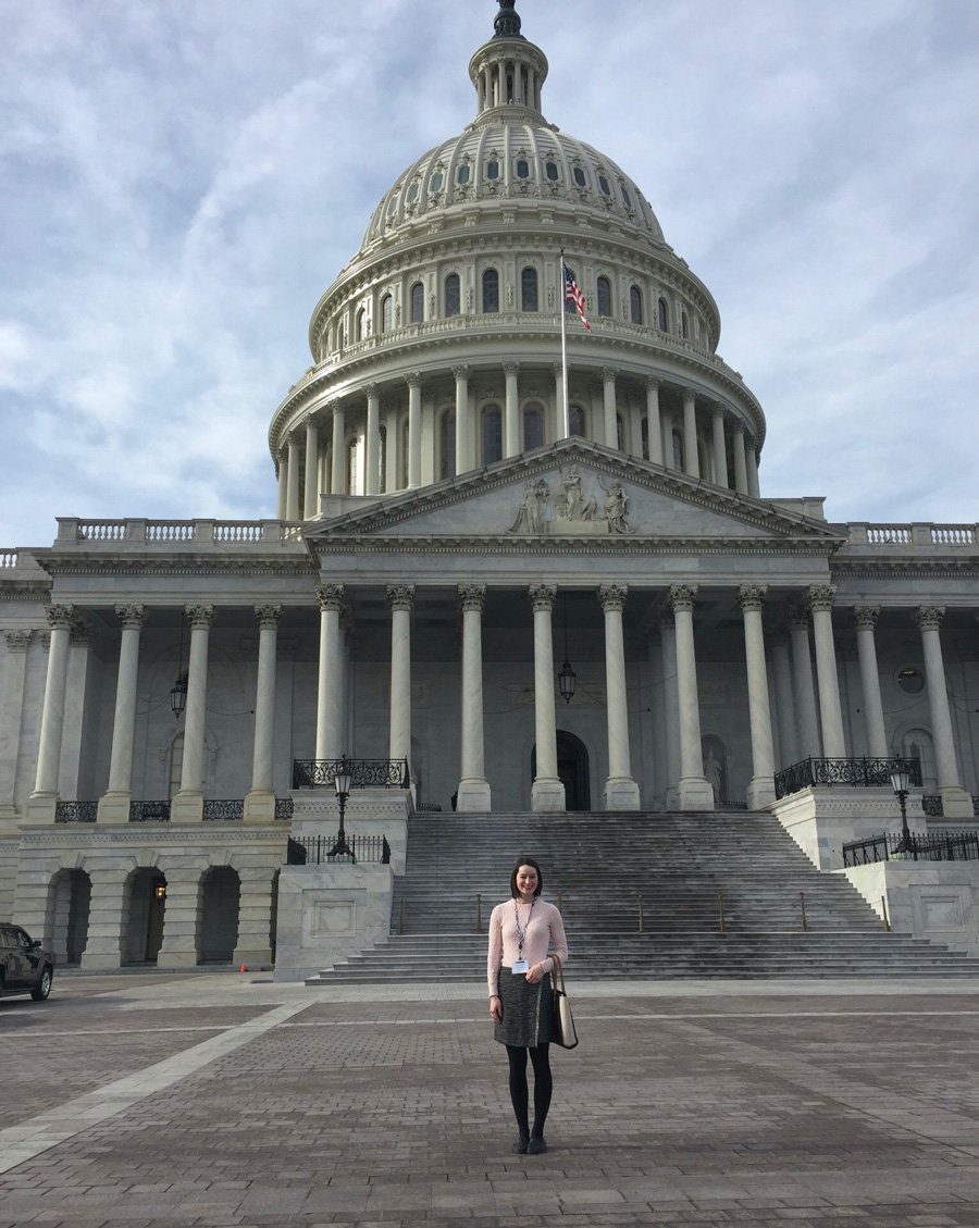Maggie Randall poses for a portrait outside the Capitol building in Washington D.C.