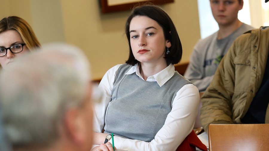 Maggie Randall listening to a lecturer in class.