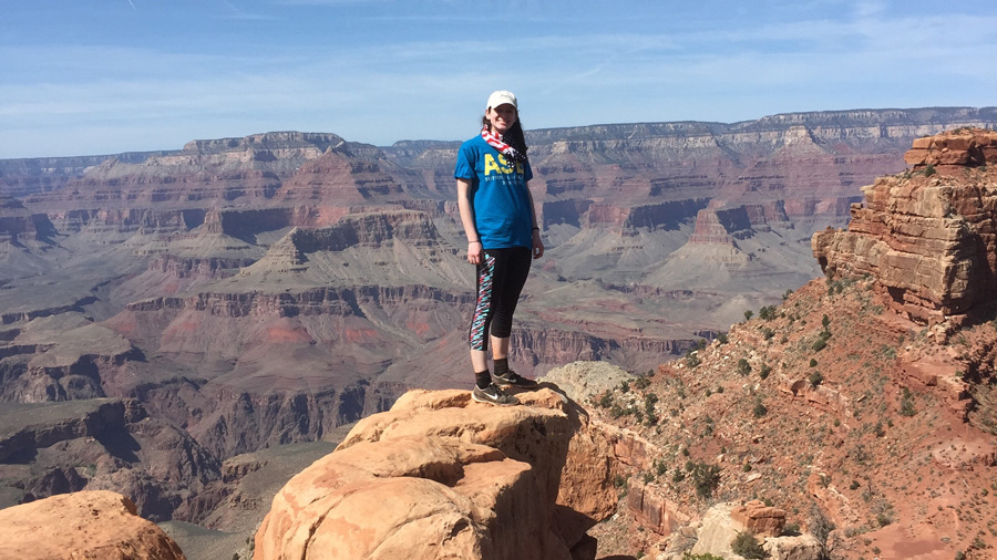 Maggie Randall posing for a picture at the Grand Canyon with Alternative Spring Break.
