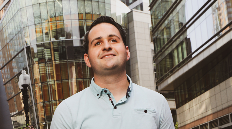 Vincent LePore gazes up Washington Street outside his company's coworking space.