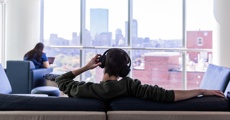 A Suffolk student sits in the study lounge on the top floor of Miller Hall.