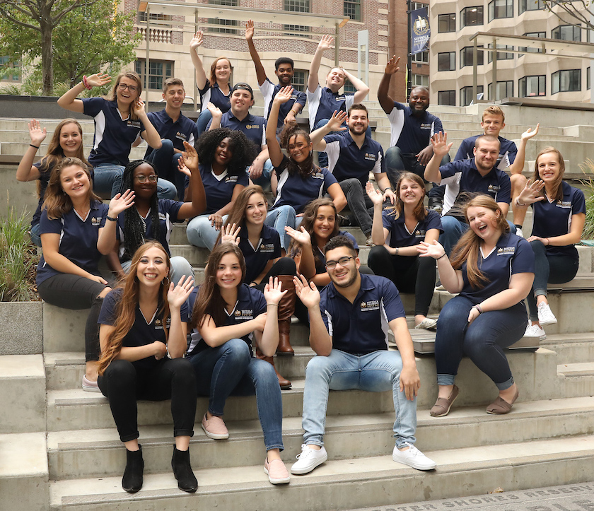 Christina Rayball sits with her Trustee Ambassador team on campus.