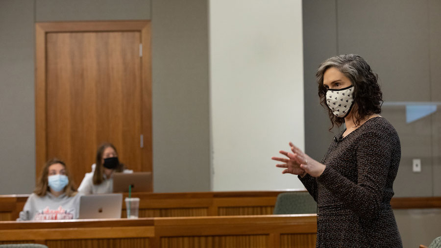 Suffolk faculty member Amy Monticello wears a mask while teaching a class in Sargent Hall.